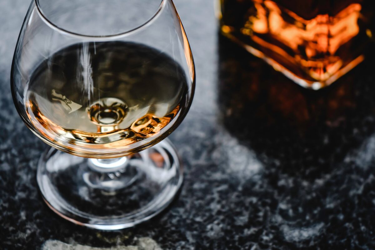 close up photo of brown liquor in a glass